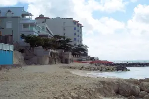 The pile of sand has been transformed into a wide beach