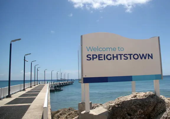 Welcome To Speightstown sign in front of the jetty