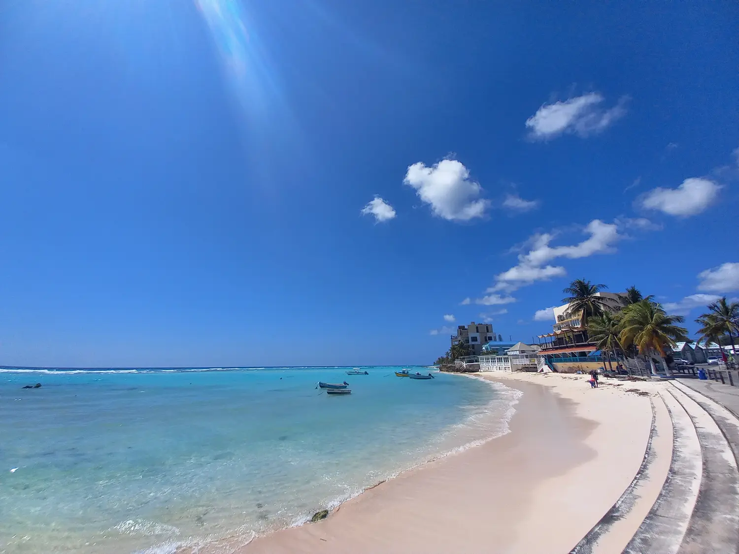 Panoramic view of the boardwalk, beach, and sea at St. Lawrence Gap.