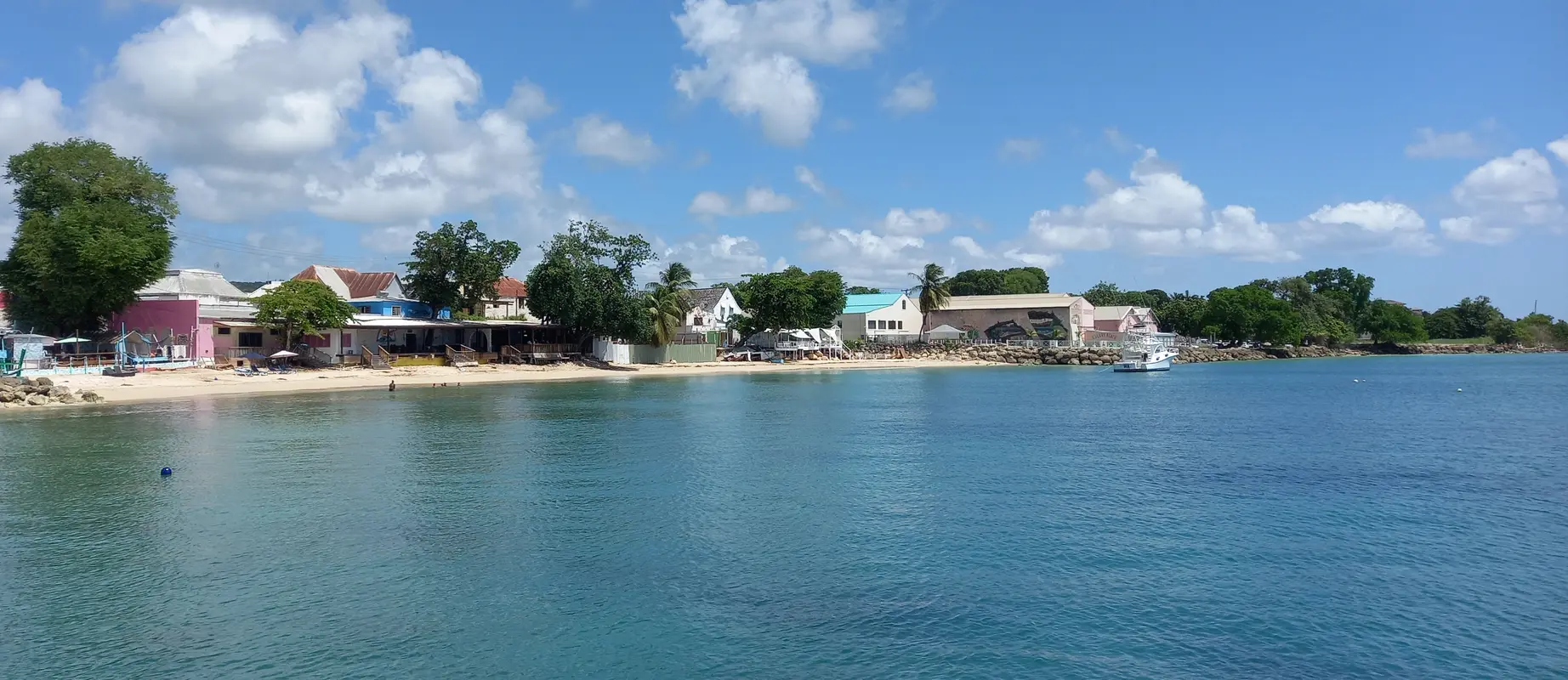 View from the jetty across the sea to a tranquil beach