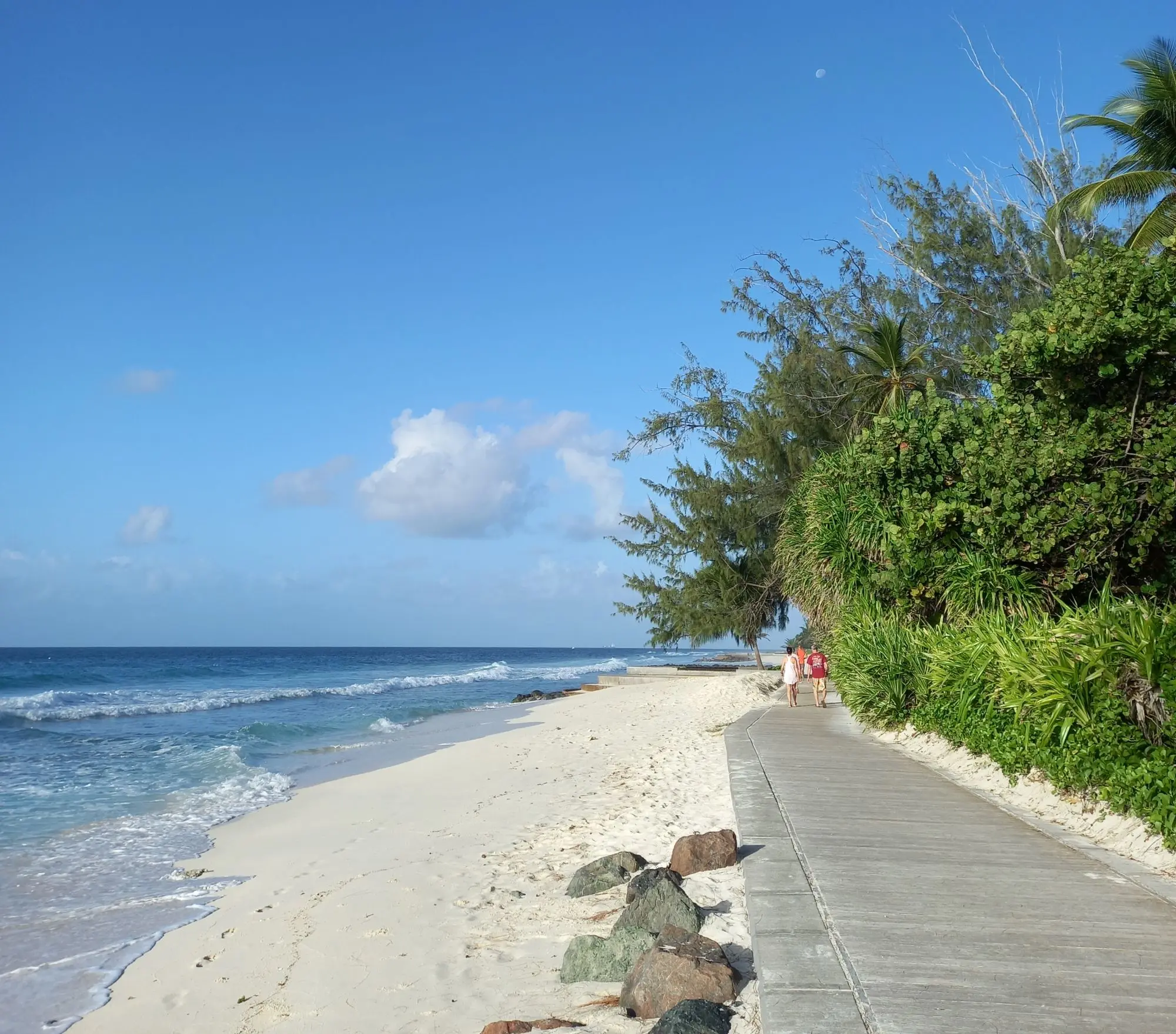 Gazing along the boardwalk with the beach and ocean on the left.