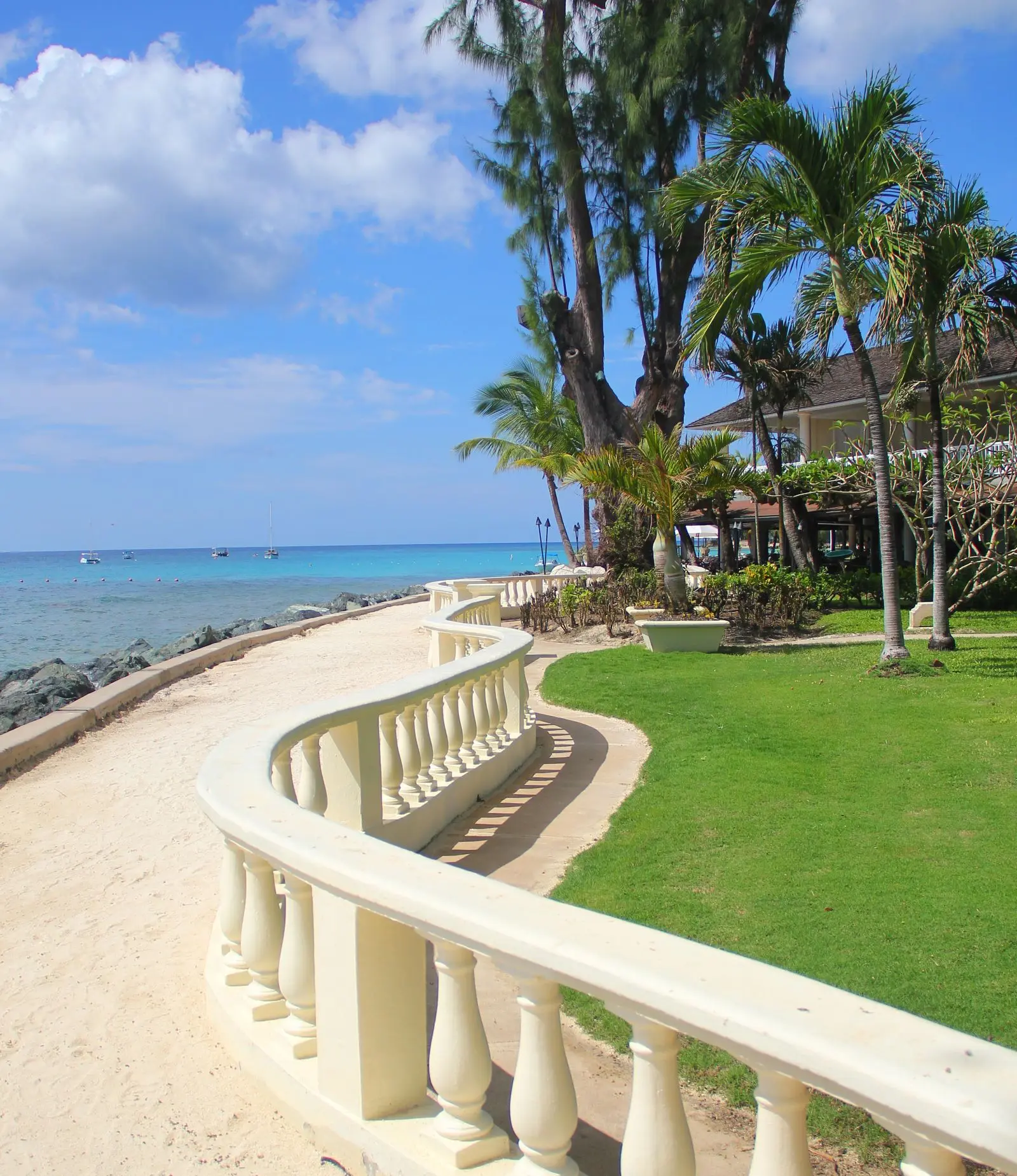 Wall alongside the boardwalk, with Coral Reef Hotel on one side and the ocean on the other